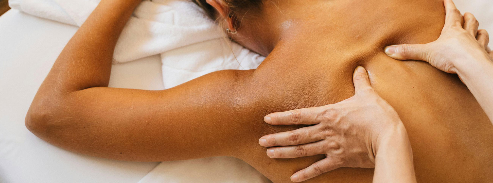 An image of back massage being carried out.